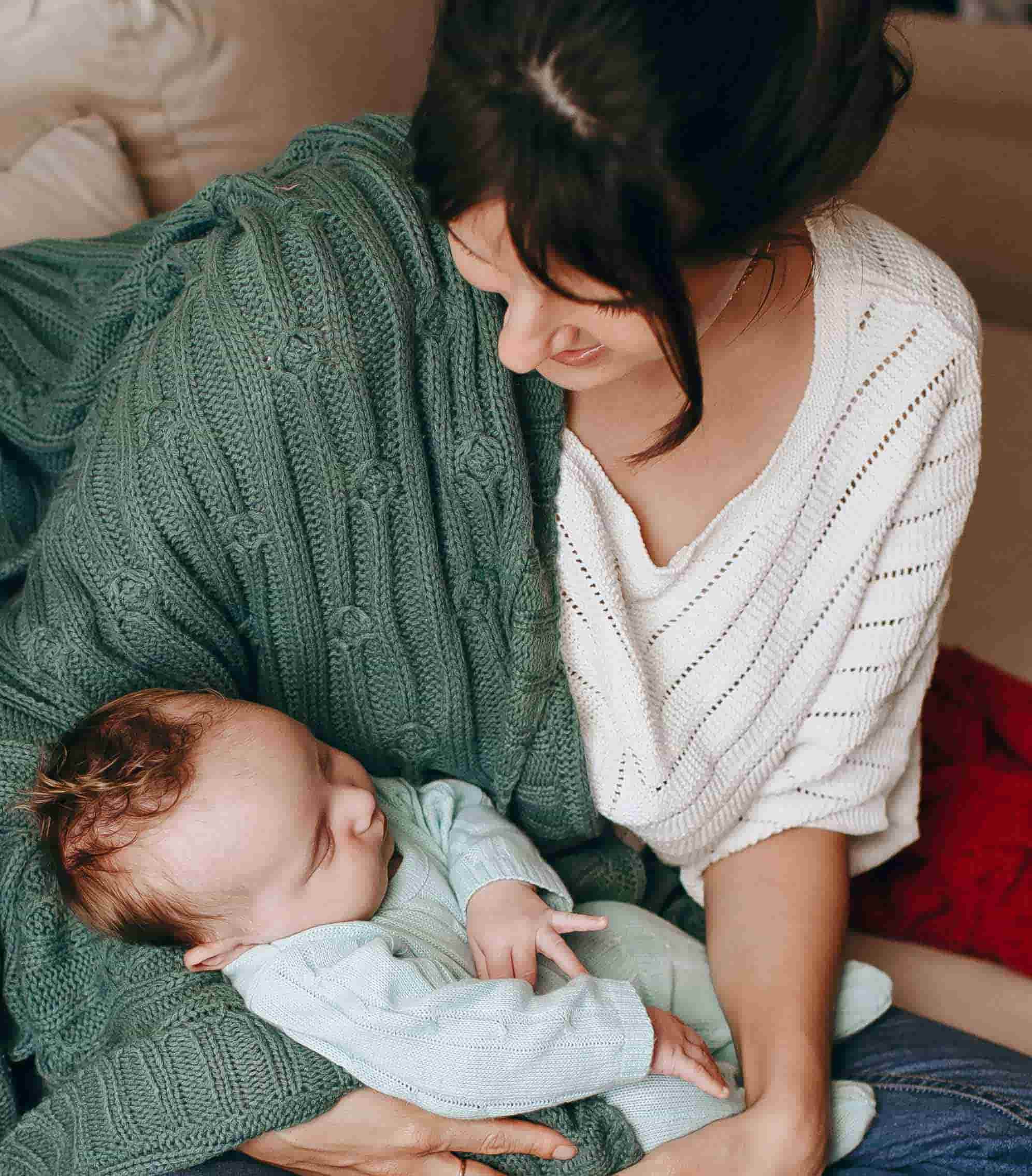 Front of zip tote bag with white canvas, black canvas straps and handle, and black zipper pulls.